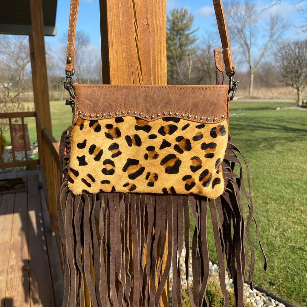 American Darling leopard hide, brown leather, fringe, studs also.  ADBG362